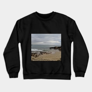 View from a sandy beach of a boat at sea Crewneck Sweatshirt